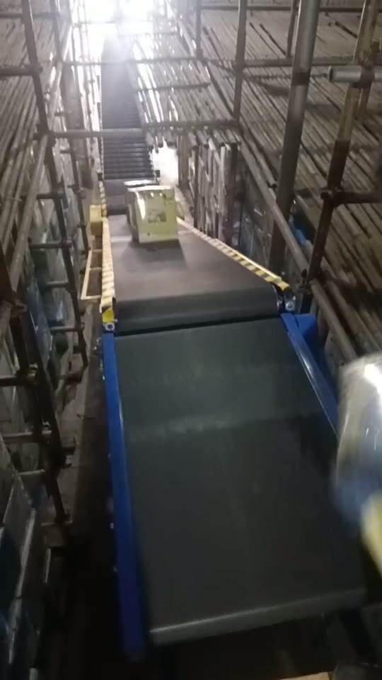 Transporting Cartons Across Elevations Along a Long Inclined Belt Conveyor